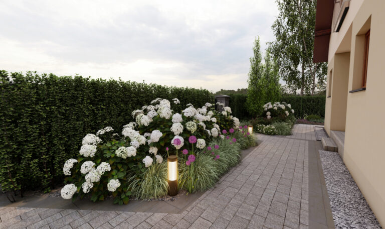 Ścieżka przy domu ozdobiona kwiatami i lampami oświetlającymi ogród